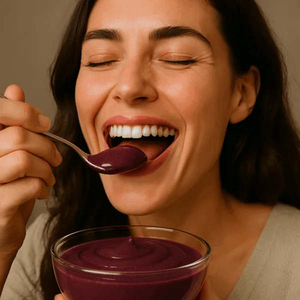 Woman enjoying a spoonful of açaí